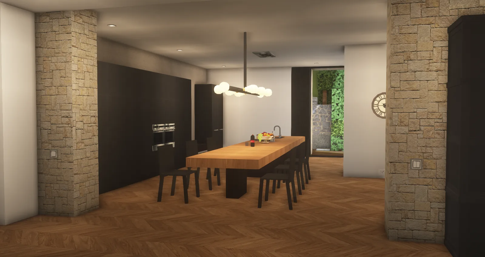 Cuisine ouverte avec grande table en bois et murs en pierre
