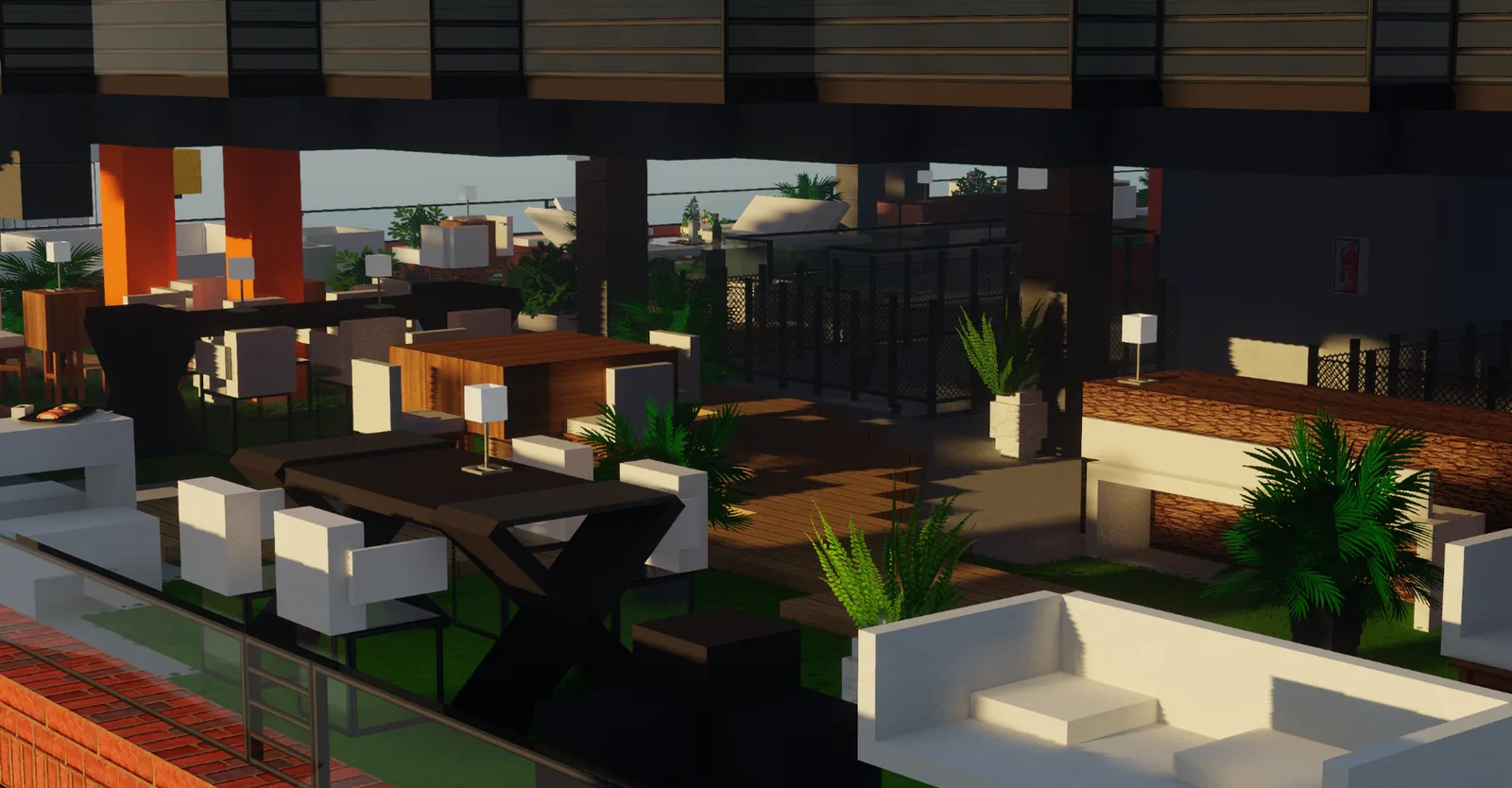 Terrasse d'appartement en hauteur au mobilier orange, vue sur la ville