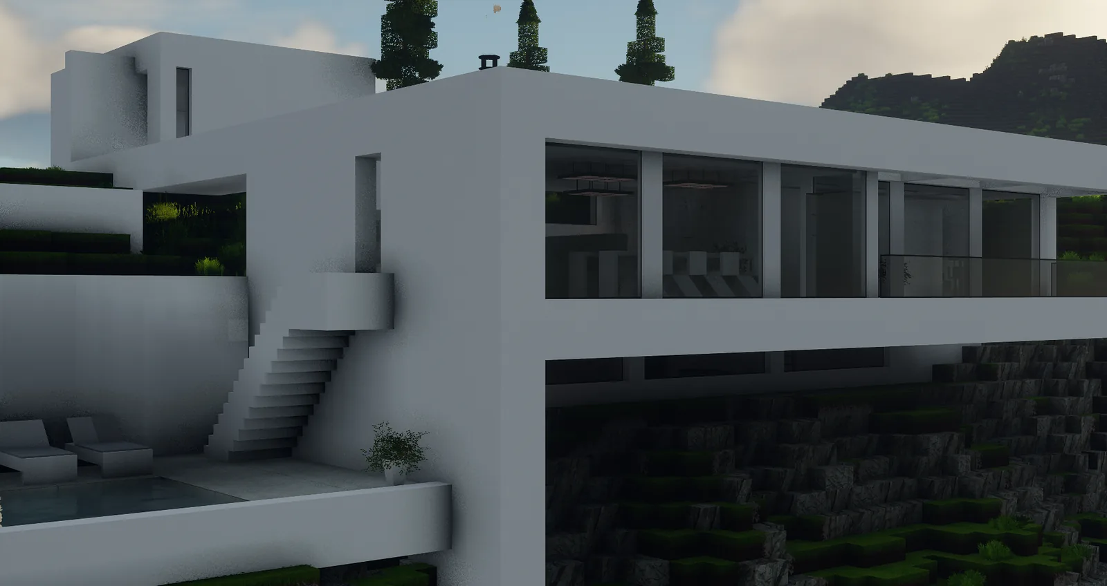 Villa moderne blanche à étage avec escalier extérieur, colline en fond